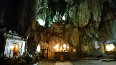 Giant Buddha statue inside the biggest cave of Marble Mountains
