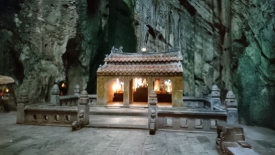 A stone shrine inside the largest cave in Marble Mountains